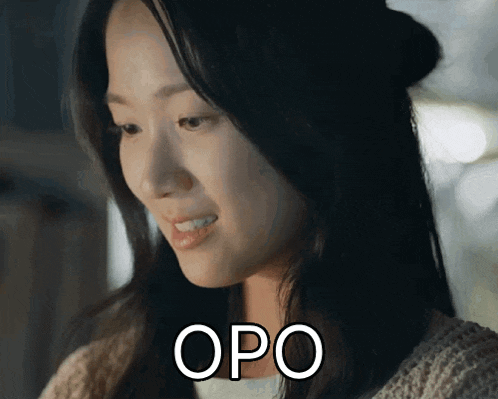 a close up of a woman 's face with the word opo on it
