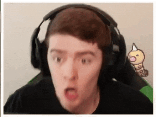 a man wearing headphones making a funny face