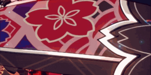 a close up of a flower on a red and purple background