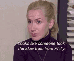 a woman is sitting in front of a window with a quote that says `` looks like someone took the slow train from philly ''