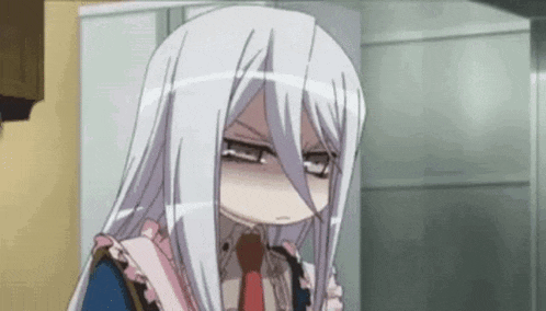a girl with long white hair and glasses is making a funny face in a room .
