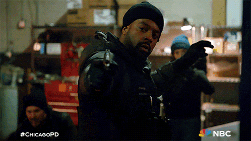 a man pointing a gun with the hashtag #chicagopd on the bottom
