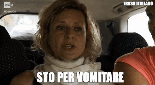 a woman sitting in the back seat of a car with the words sto per vomitare below her