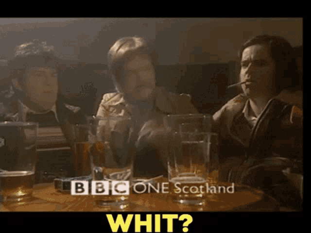 a group of people sitting at a table with bbc one scotland written on the screen