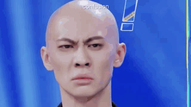 a bald man with a surprised look on his face is making a funny face .
