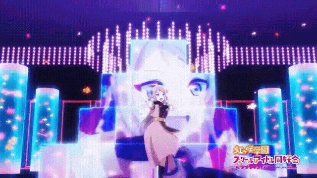 a girl in a pink dress is dancing on a stage with a sign that says rainbow school