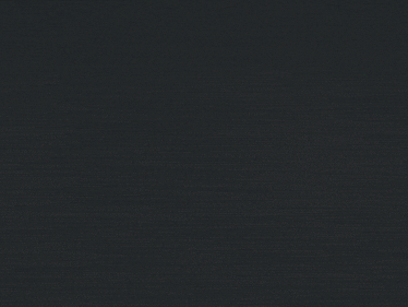 a close up of a black object with the letter v visible