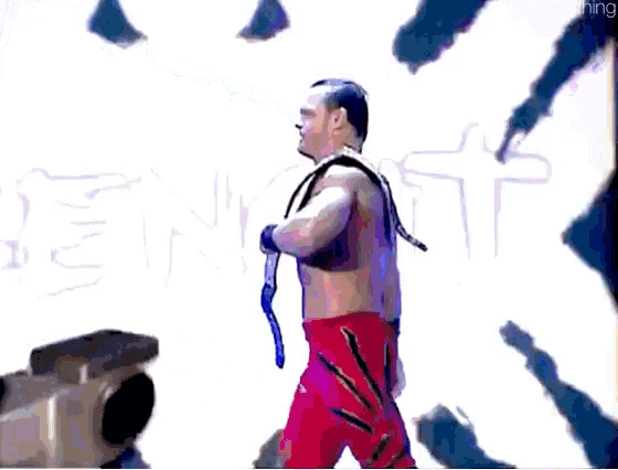 a wrestler named chris is standing in front of a sign that says world heavy