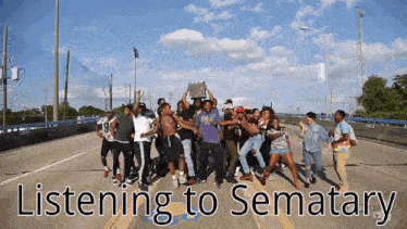 a group of people are dancing on a highway with the words listening to sematary written below them