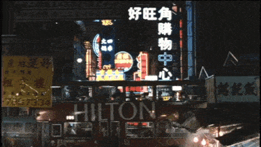 a crowded street scene with a sign that says 798/634