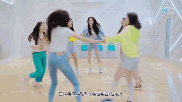 a group of girls are dancing in a circle with the words mp4 in the bottom right corner
