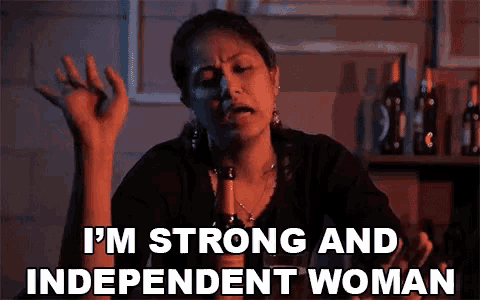a woman is holding a beer bottle and saying i 'm strong and independent woman .