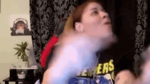 a woman wearing a shirt that says ' ers ' on it