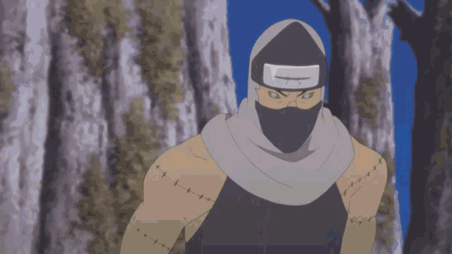 a man with stitches on his arm is wearing a gray scarf around his head