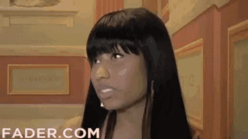 a close up of a woman 's face with the website fader.com visible in the corner