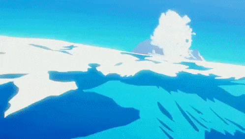 a large iceberg is floating in the ocean with a mountain in the background