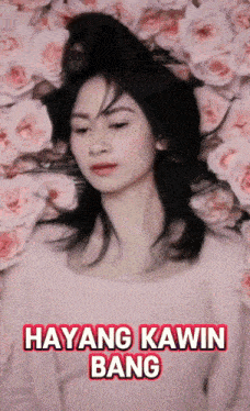 a woman in a pink shirt is laying in a pile of pink roses with hayang kawin bang written on the bottom
