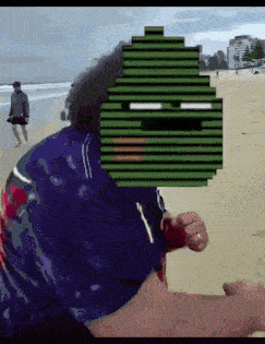 a man is running on the beach with a pixelated face behind him