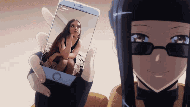 a person is holding a cell phone that says tik tok on the screen