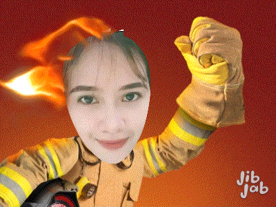 a woman in a fireman 's uniform is holding a torch