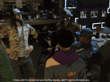 a man in a hawaiian shirt is talking to raymond kenney in a video game