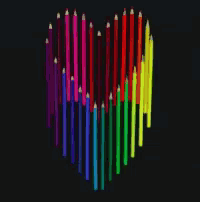 colored pencils arranged in the shape of a heart on a black background