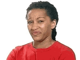 the woman is wearing a red shirt and making a funny face