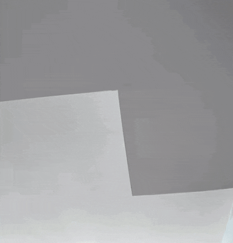 a person is standing in a room with a white wall