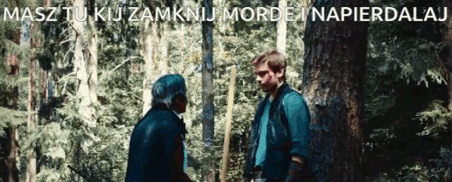 two men are standing in a forest with the words masz tu kij zamknij morde napierdalaj