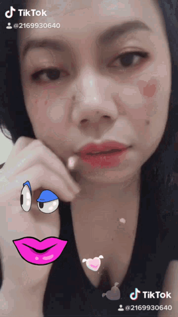 a woman with a cartoon face on her face has a tiktok sticker on her face