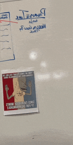 a person standing in front of a white board with a picture on it that says ' i 'm sorry '