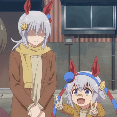 a man and a girl are standing next to each other and the girl is wearing a headband with horns
