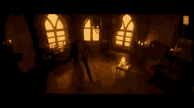 a man and a woman are kissing in a dark room in front of a window .