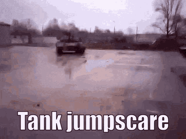 a tank is driving down a wet road with the words tank jumpscare written on it