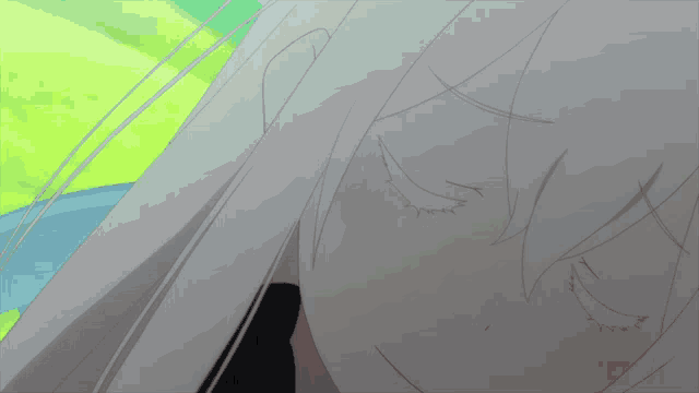 a close up of a person 's face with a green background