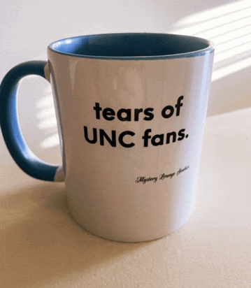 a coffee mug that says tears of unc fans on it
