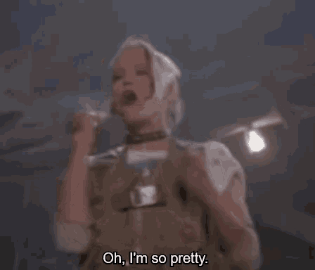 a blurry picture of a woman saying oh i 'm so pretty .