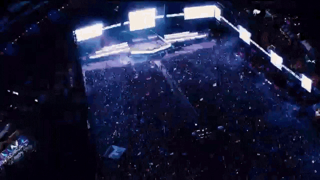 an aerial view of a crowd at a concert with a sign that says ' nbc ' on it