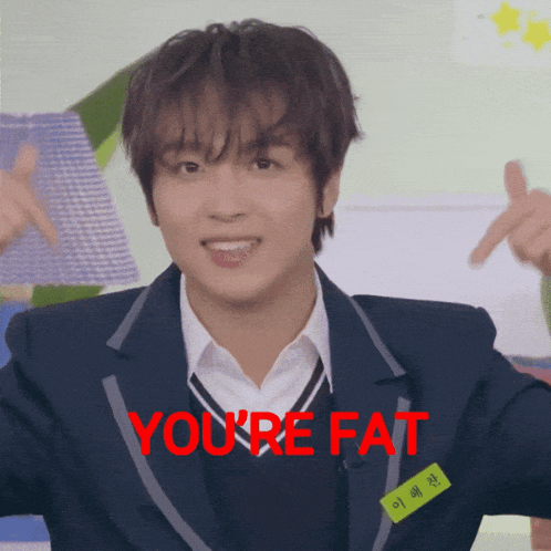 a man in a school uniform says you 're fat in red letters
