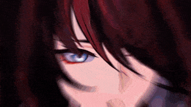 a close up of a person 's face with blue eyes and red lips