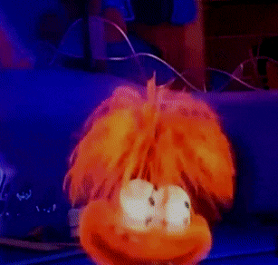 a close up of a cartoon character 's face with a blue background