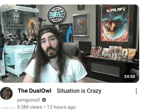 a man with long hair and a beard is sitting in front of a screen that says " the dualowl situation is crazy "