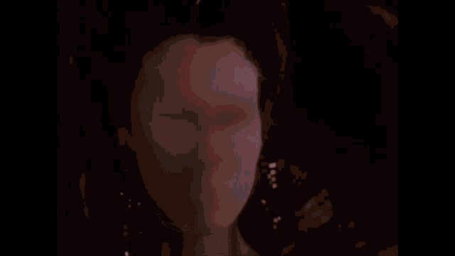 a close up of a person 's hand holding a glowing object