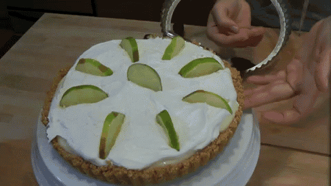 a pie with sliced apples on top of it