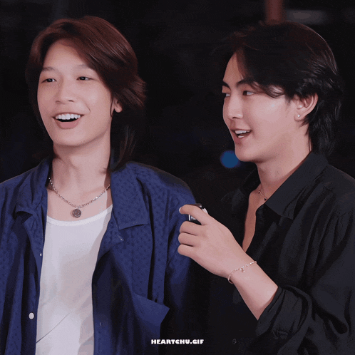 two young men are standing next to each other and the gif says heartchu.gif on the bottom