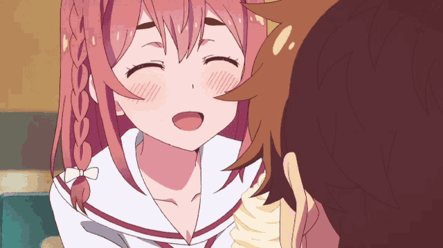 a girl with pink hair is smiling at a man