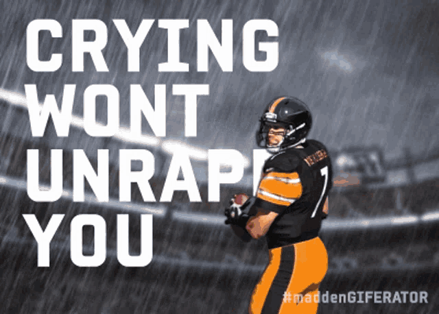 a football player in the rain with the words crying wont unrape you above him