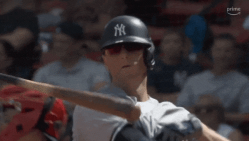 a new york yankees baseball player is getting ready to bat