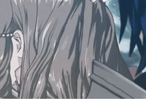 a close up of a person 's hair with a pearl earring