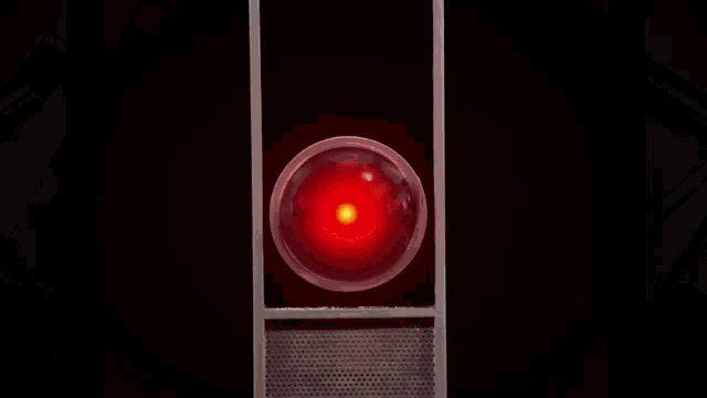 a red light with a yellow center is surrounded by three other lights